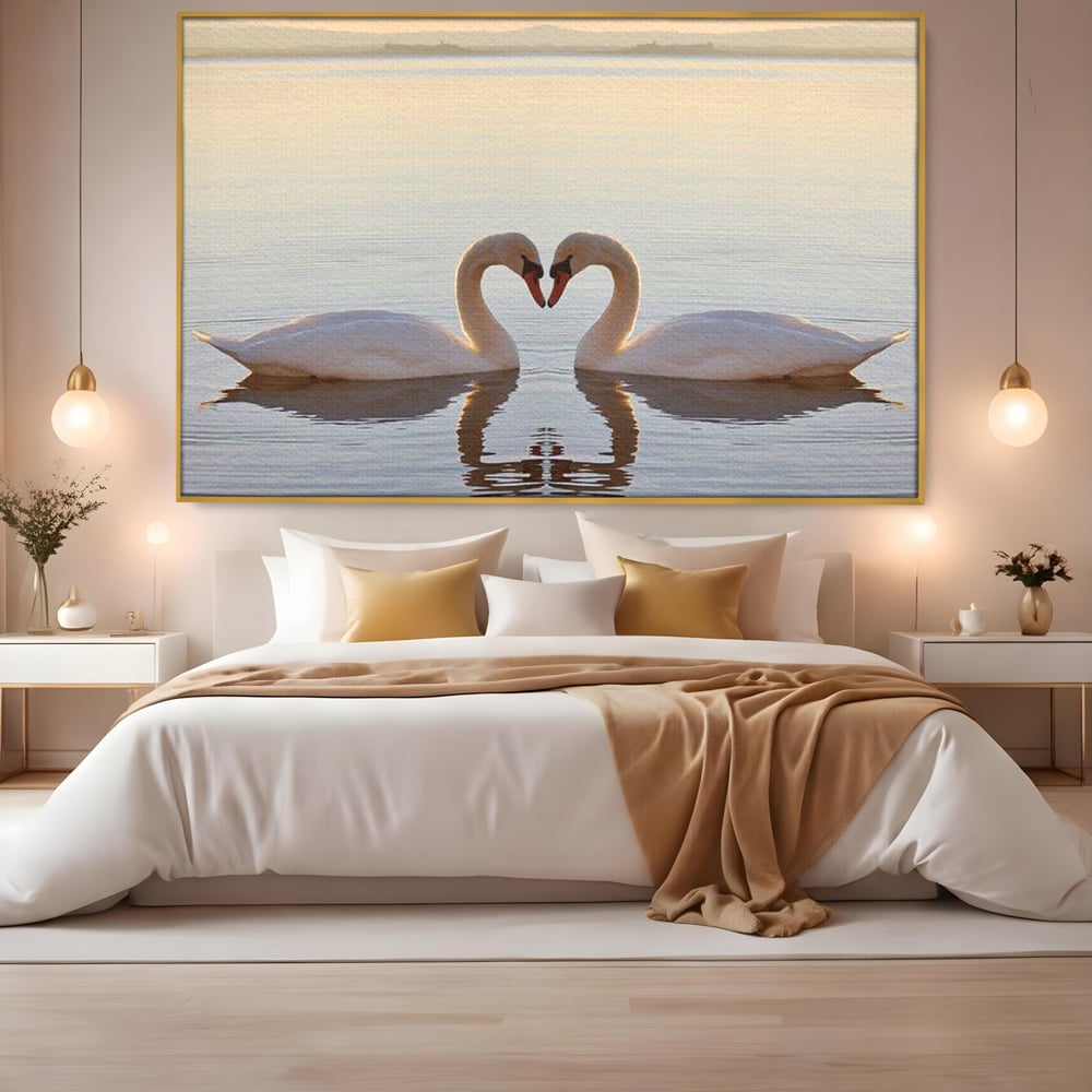 Tablou canvas cu tablou canvas cu lebede pe lac, in rama de aluminiu auriu, pe perete intr-un dormitor